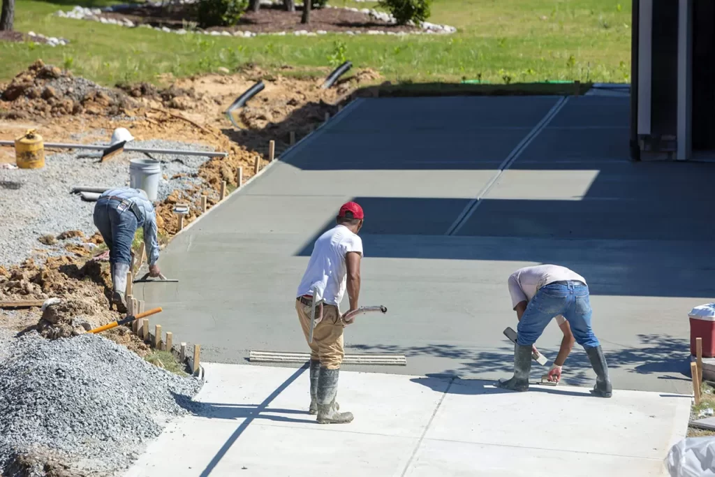 Construction Workers Pouring Concrete